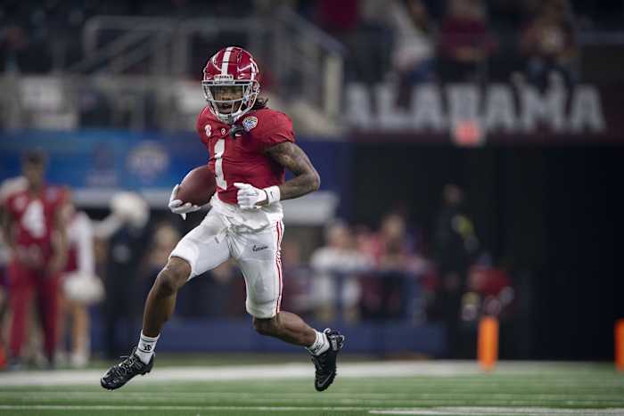 Alabama WR Jameson Williams runs after catch